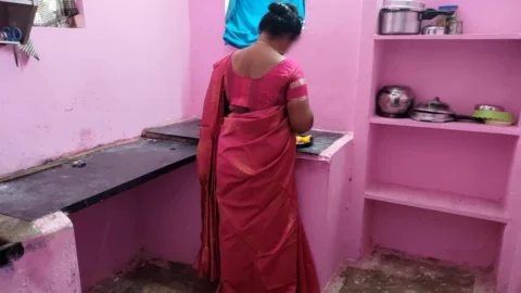 Aunty was searching for a fallen mango in the kitchen and I went behind her and grabbed her rear and licked her pussy wit