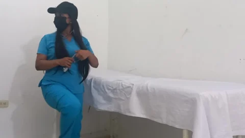 My nurse massages her pussy and moans with pleasure in her office