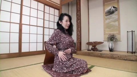 Busty Japanese granny strips and rides cock