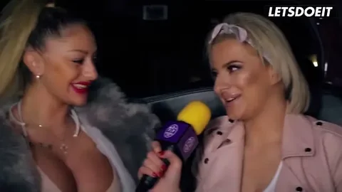 Curvy women share intimate moment in luxury car