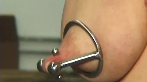 Redhead MILF Submits to Weighted Nipple Clamps