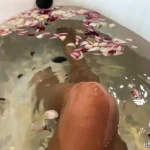 Bath of Blossoms Naked MILF Masturbates Among Flowers
