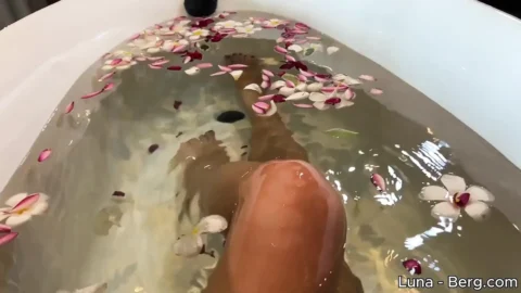Bath of Blossoms Naked MILF Masturbates Among Flowers